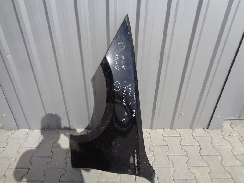 BMW 1 E81 E87 BŁOTNIK LEWY ORYGINAŁ CZARNY 7133227